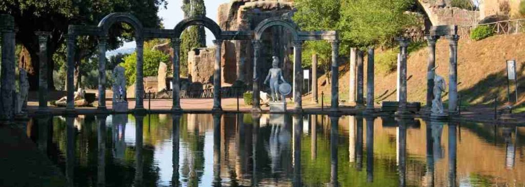 A stunning view of Villa Adriana in Tivoli, Italy, showcasing the well-preserved ancient Roman architecture, expansive ruins, and beautiful gardens. The image highlights the historical and architectural significance of this UNESCO World Heritage site.