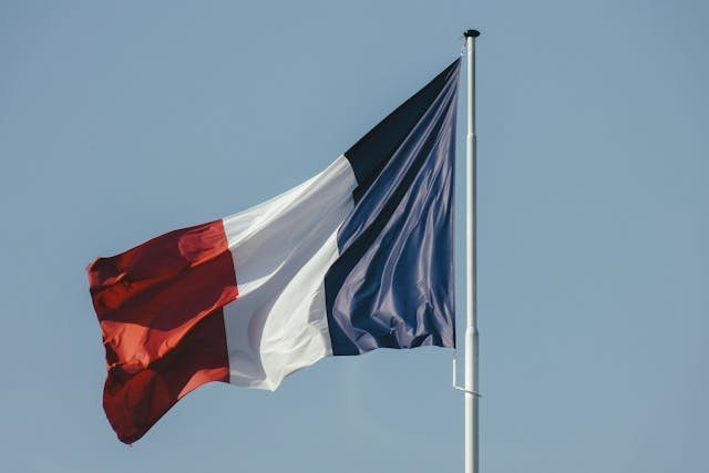The flag of France, featuring three vertical stripes of blue, white, and red. The colors are arranged from left to right with blue on the left, white in the center, and red on the right, representing the French national colors
