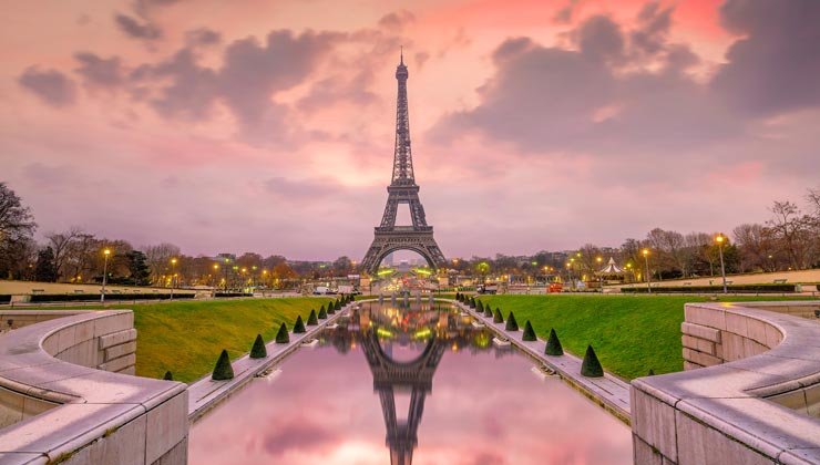A stunning view of Paris, France, featuring iconic landmarks such as the Eiffel Tower, the Louvre, and charming Parisian streets. The image captures the romance and elegance of this renowned city.